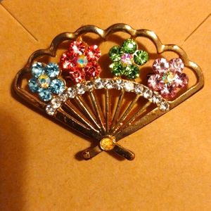 Vintage rhinestones fan brooch 2"w x 1"h.